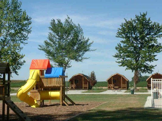 The playground with cabins behind it