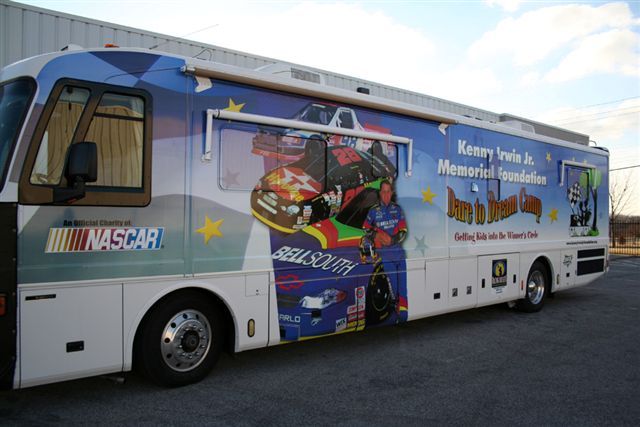 A motorhome wrapped in Kenny Irwin Jr. Memorial Foundation graphics