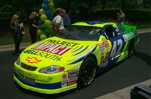 Kenny Irwin Jr. with a FEMA Project Impact logo on his car, Charlotte, May 2000